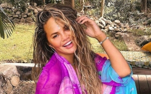 Chrissy Teigen Slips Into Hooters Costume for Pal's birthday