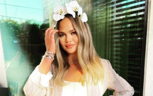 Chrissy Teigen Presses on With Important Zoom Call While Being Examined at Doctor's Office