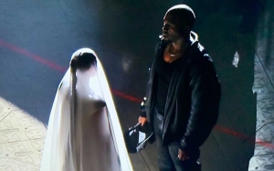 Kim Kardashian Baffles Fans by Showing Up in Wedding Dress at Kanye West's 'Donda' Event