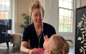 Twitter Wonders If Amber Heard's Daughter Is Real as the Baby 'Keeps Changing Sizes'
