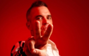Robbie Williams Feels 'Strange' After Breaking Elvis Presley's Chart Record