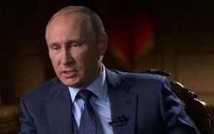 Vladimir Putin Shows Marks Thought to Be Signs of Cancer Treatment During Rare Appearance
