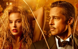 Margot Robbie Sneaks a Kiss With Brad Pitt in 'Babylon'