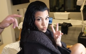 Kourtney Kardashian Accused of Holding 'Fake' Baby Rocky in Australian Outing