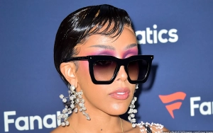 Doja Cat Reacts to Trolls Comparing Her Hair to 'Pubic Hair, Carpet, and Sheep's Wool'