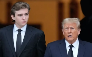 Donald Trump's Son Barron Looks Glum While Golfing With His Father