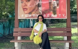 Rihanna Waiting at Bus Stop in Cheeky Photo to Promote Fenty Beauty