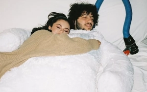Selena Gomez and Benny Blanco Share a Kiss in Cuddly Holiday Pic