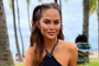 Chrissy Teigen Almost Bares All to Show Off Scar From Breast Implant Removal Surgery