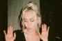 Miley Cyrus Dances in Plunging Black Dress as She Celebrates 'Flowers' Huge Success
