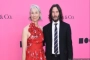 Keanu Reeves and GF Alexandra Grant Lock Lips During Rare Red Carpet Date Night