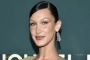 Bella Hadid Runs Around Beach in Sizzling Outfit