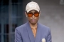 Pharrell's Attempts to Hug Rejected by Angry Animal Rights Activist Outside GQ Party