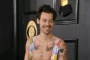 Harry Styles Unveils Vibrant New Video for Coming Up Roses from Latest Album