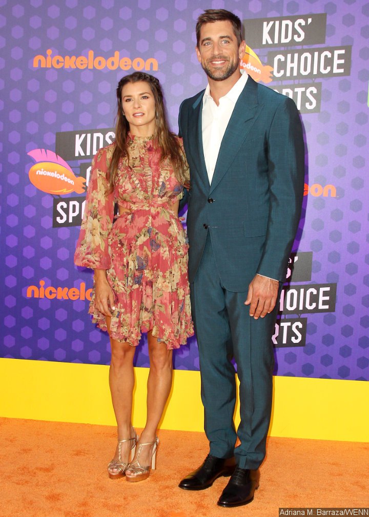 Danica Patrick and Aaron Rodgers attend Nickelodeon's Kids' Choice Sports Awards 2018 together