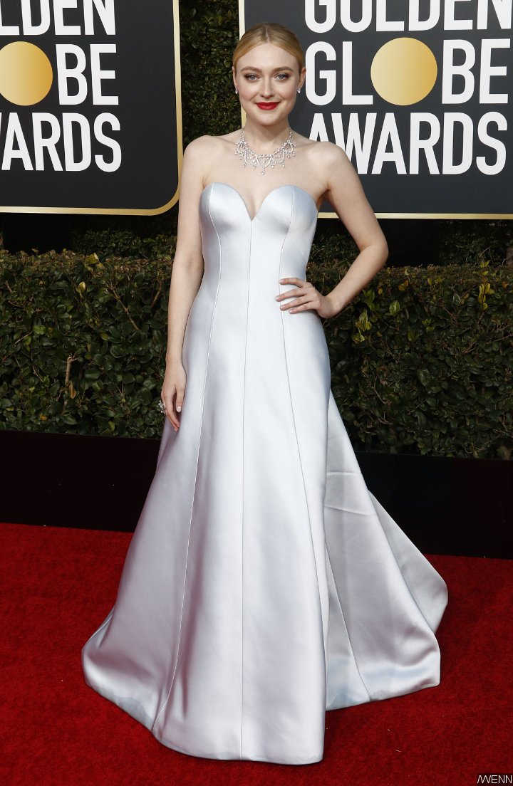 Dakota Fanning on Golden Globes red carpet.