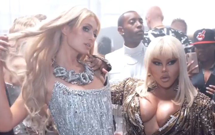Watch: Lil' Kim Plays Surprise Performance at The Blonds' Saucy NYFW Show Beside Paris Hilton