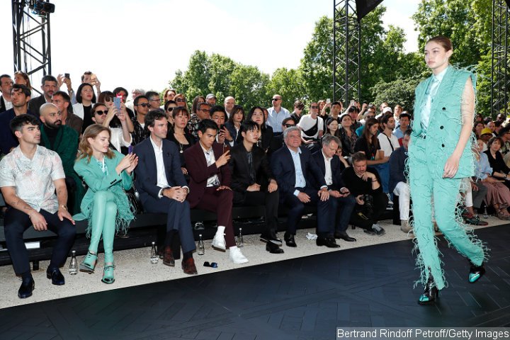 Joe Jonas Attends Paris Fashion Week While Gigi Hadid Walks the Runway