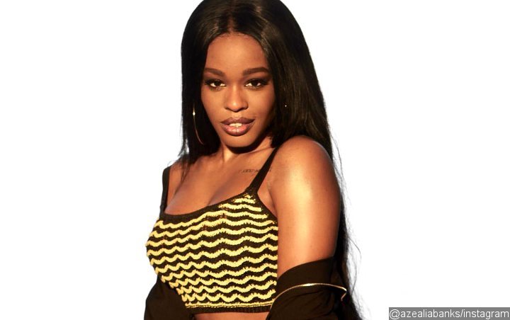 Azealia Banks Looks Unrecognizable in Rainbow Hair and Pink Eye Contacts