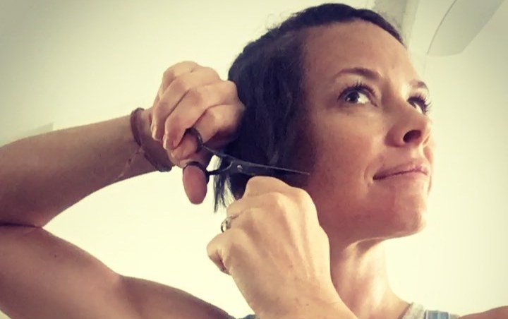 Watch: Evangeline Lilly Picks Up Scissors and Starts Hacking Her Own Hair