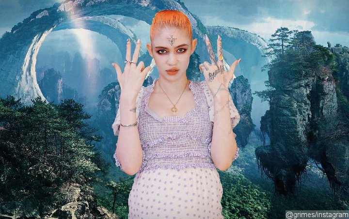 Grimes Fuels Pregnancy Buzz With Nude 'Knocked Up' Post