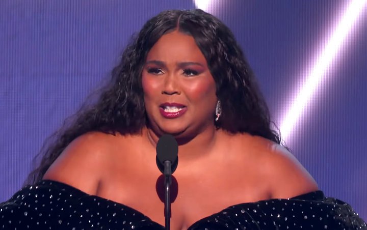 Video: Lizzo Flustered After Tripping and Dropping Her Grammy Award