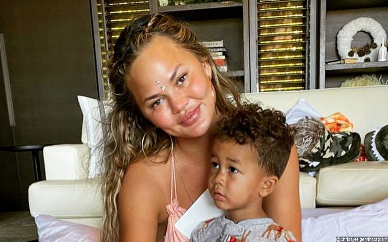 Chrissy Teigen Blames Son Miles' Tendency to Stay 'Butt A** Naked' for Lack of Social Media Posts