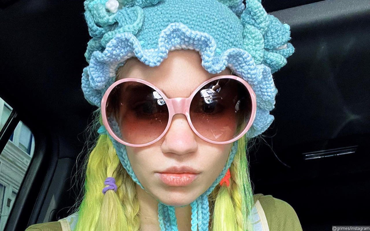 Grimes Teases She's 'One Step Closer' to Ink Her Face After Debuting New Leg and Ear Tattoos