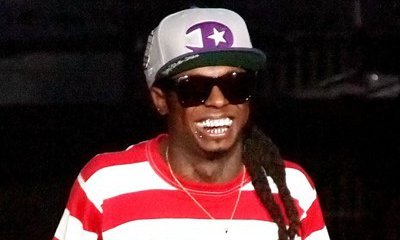Lil Wayne Hints He's No Longer Representing Cash Money
