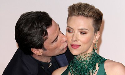 Oscars 2015: John Travolta Kisses Scarlett Johansson in Awkward Encounter