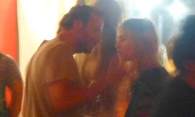 Bradley Cooper and Suki Waterhouse Get Cozy at Coachella