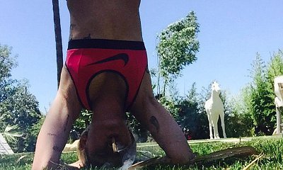 Miley Cyrus Smoking Suspicious Cigarette While Doing Yoga Headstand