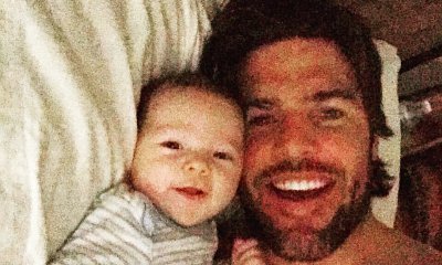 Mike Fisher Shares Shirtless Selfie in Bed With Son Isaiah