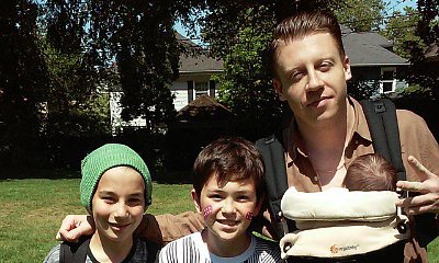 Macklemore Reportedly Welcomes First Child, Is Pictured Carrying a Baby