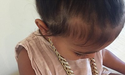 North West Steals Daddy Kanye West's Diamond Gold Chain in New Pic