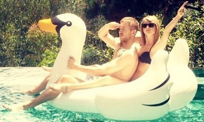Taylor Swift and Calvin Harris Ride Inflatable Swan Together in New Pic