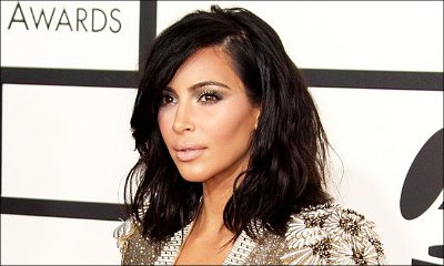 Kim Kardashian Threatens to Sue Photo Agency Over Intrusive Nude Pool Photos