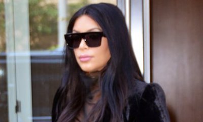 Kim Kardashian Wears Fuzzy Slippers to Alleviate Her Swollen Ankles