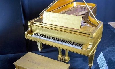 Elvis Presley's Gold Piano and Beatles Drum Skin Set for Auction