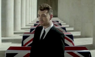 Sam Smith Walks Among Coffins in 'Writing's on the Wall' Music Video Preview
