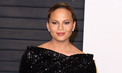 Chrissy Teigen Exposed! Model Flashes Nipples in Black Panel Dress