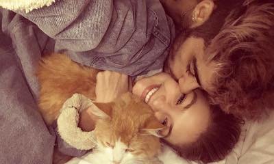 Gigi Hadid Kissed by Zayn Malik in a Photo Honoring Her Late Cat