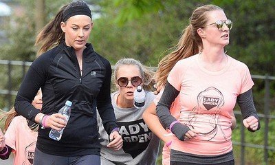 Cara Delevingne Takes Tumble During Charity Run With Sister Chloe in London