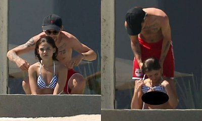 Louis Tomlinson Pictured Helping Undress His Girlfriend, Angry About Leaked Topless Pics
