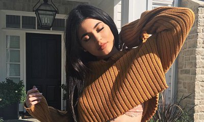 Kylie Jenner Shows Off Toned Abs and Flashes Lace Bra in Ripped Crop Top