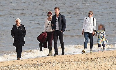 Photos: Taylor Swift and Tom Hiddleston Hit the Beach in U.K. Joined by His Family
