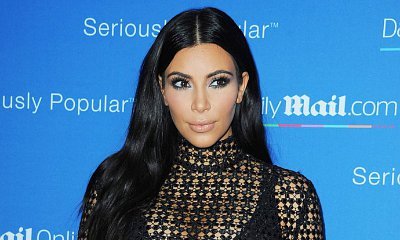 Kim Kardashian Flashes Some Serious Underboob While Taking Shower in Mexico