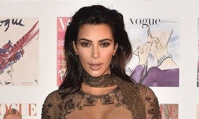 Kim Kardashian Parades Her Hot Bod in Bikini While on Beach With North and Saint West