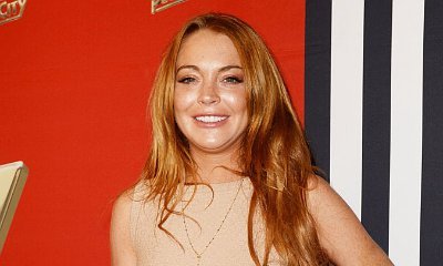 Lindsay Lohan Almost Spills Out of Her Bikini During Yacht Trip in Sardinia