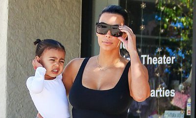Kim Kardashian and North West Glam Up in Silver for Kanye's Concert